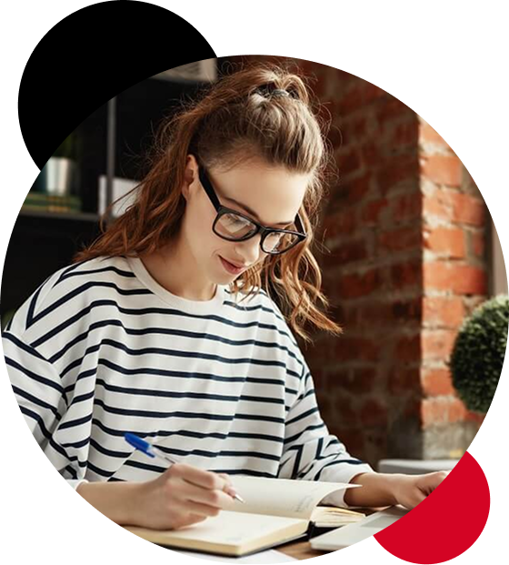 Researcher writing in a notebook